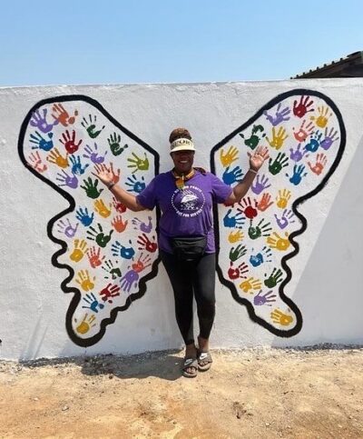 yolonda woodson, community engagement manager painted mural