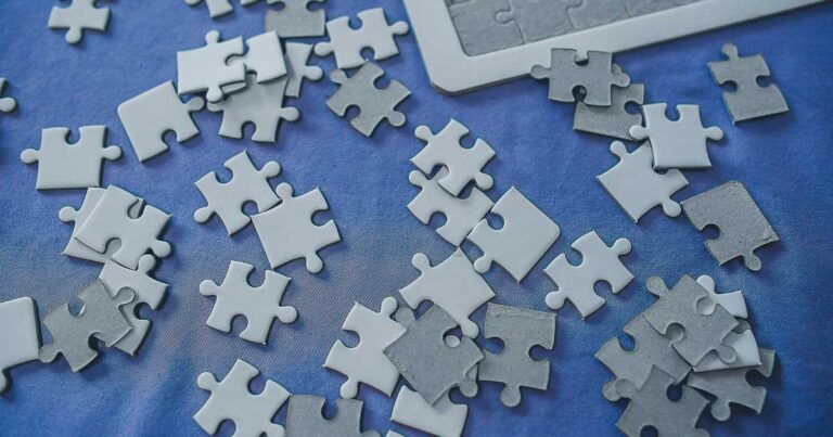 puzzle pieces on blue sheet